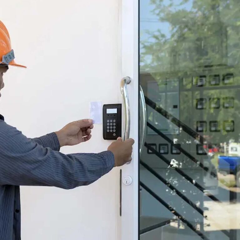 Technician installing a key card access control system at a business in Colorado